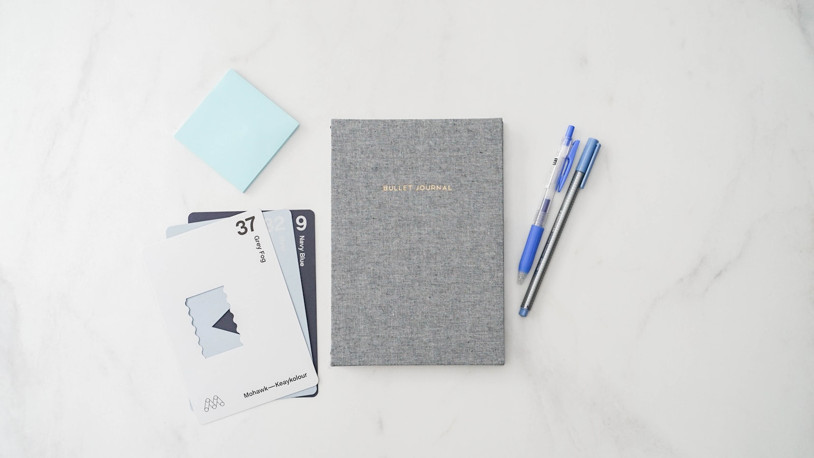 Open notebook and pen on a desk — agency planning